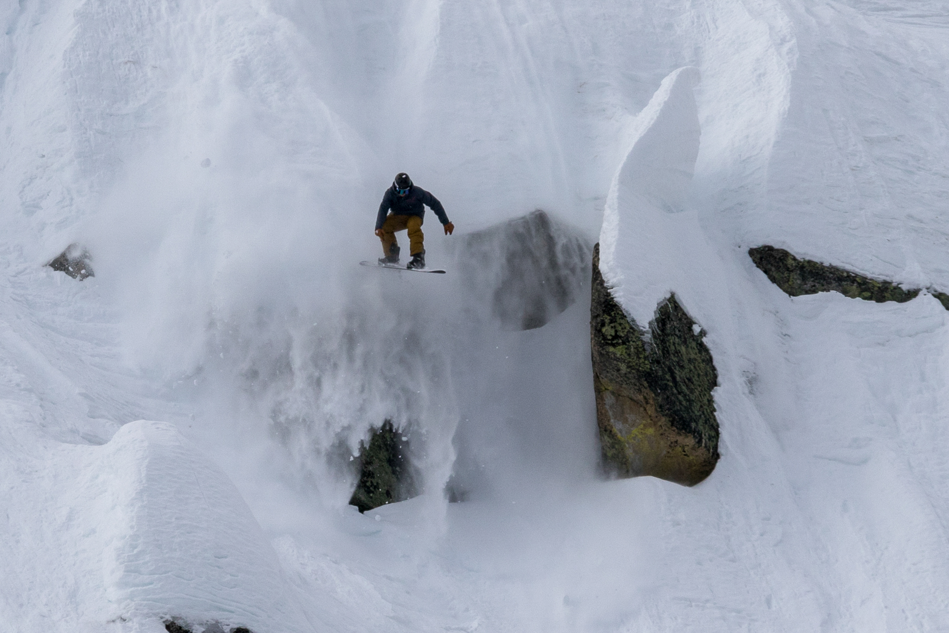 Unknown Snowboarder Dropping cliff in Huckleberry Canyon | Sierra At Tahoe